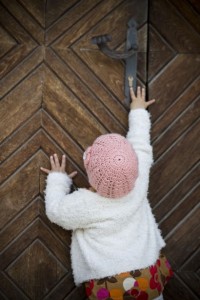 child-opening-the-door